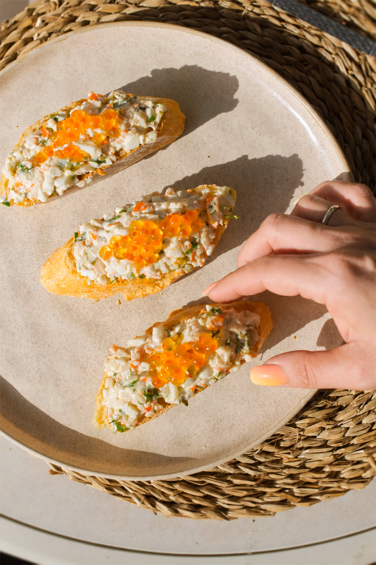 Txaka pinchos A person reaches in to grab a Txaka Pintxo on a plate