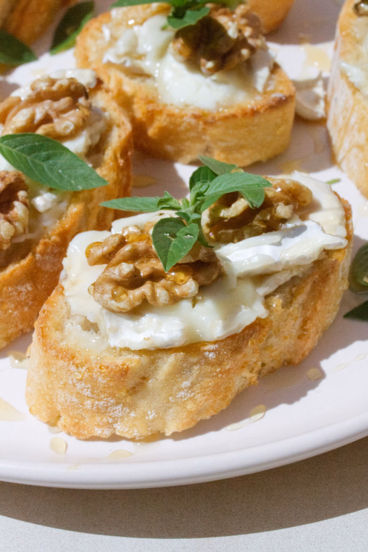 A platter of Goat cheese pintxos with walnuts and drizzled with honey