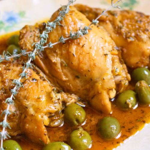 A large platter of Valencian Chicken With Citrus And Vermouth.