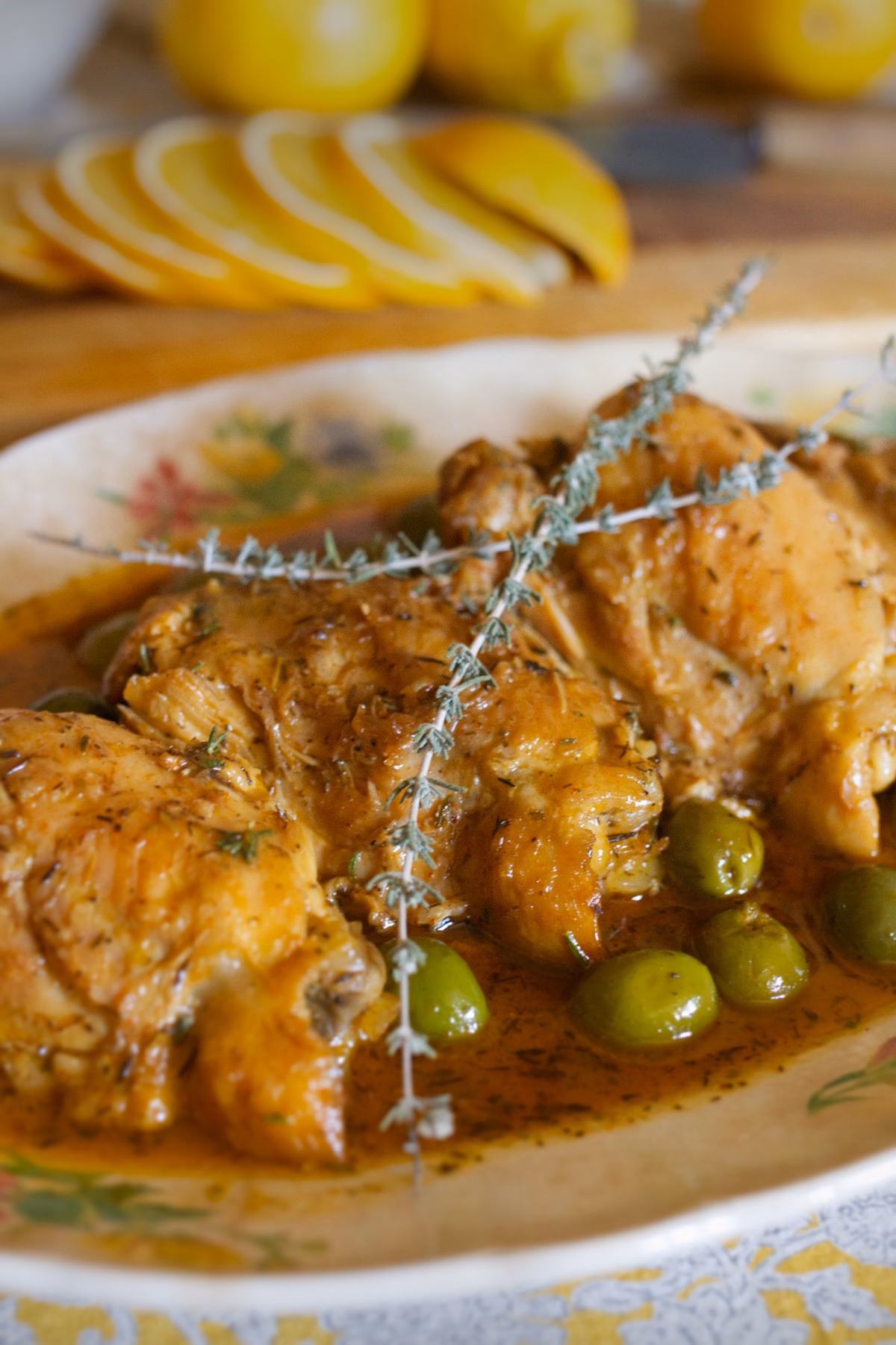 A large platter of Valencian Chicken With Citrus And Vermouth.